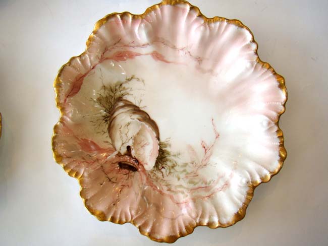 A fine and rare set of four vintage hand-painted Limoges bone china shell and flora plates circa 189 — image 2